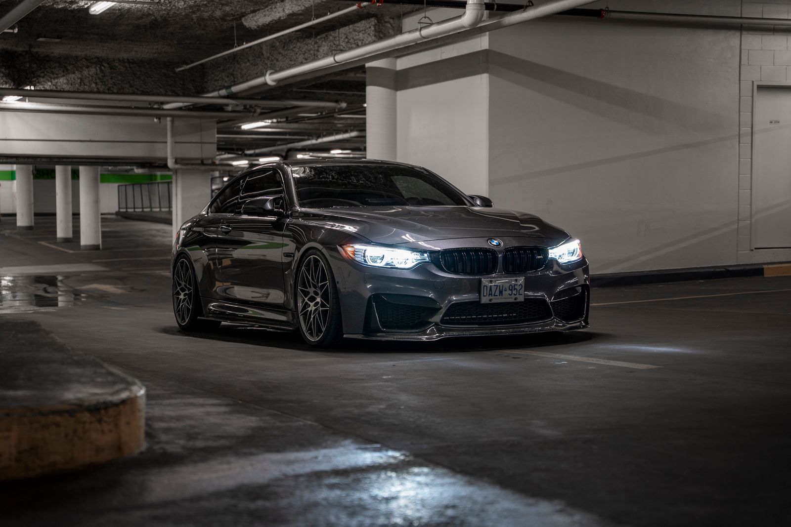 Black BMW parked in an underground garage